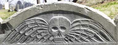 Winged Death's Head on Headstone of Mary Lattimer (1681).